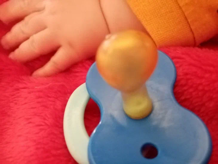 Pacifier with a hand